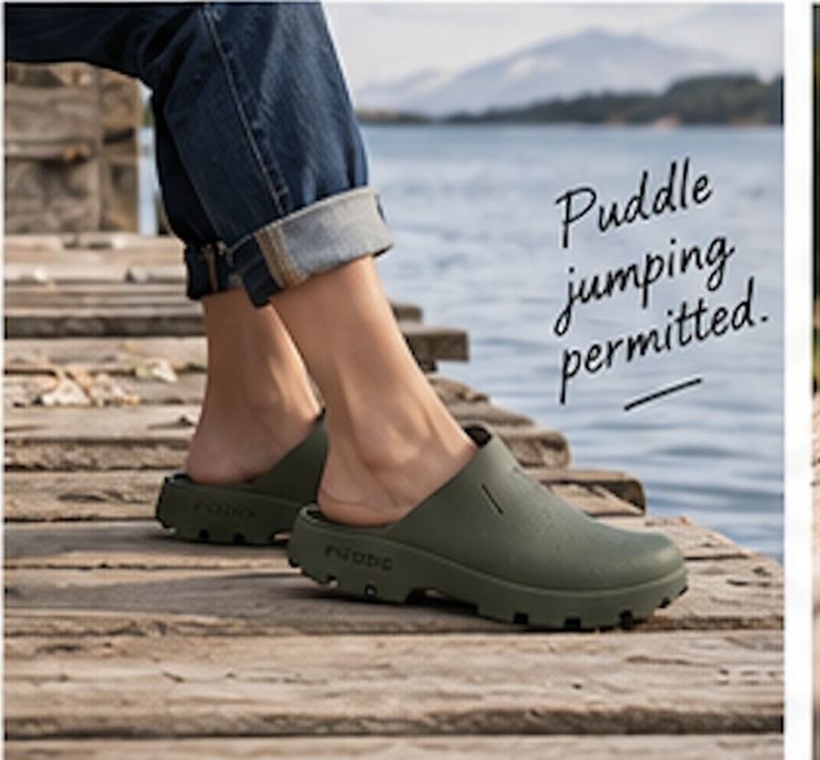 Child in olive PUDDS on a jetty