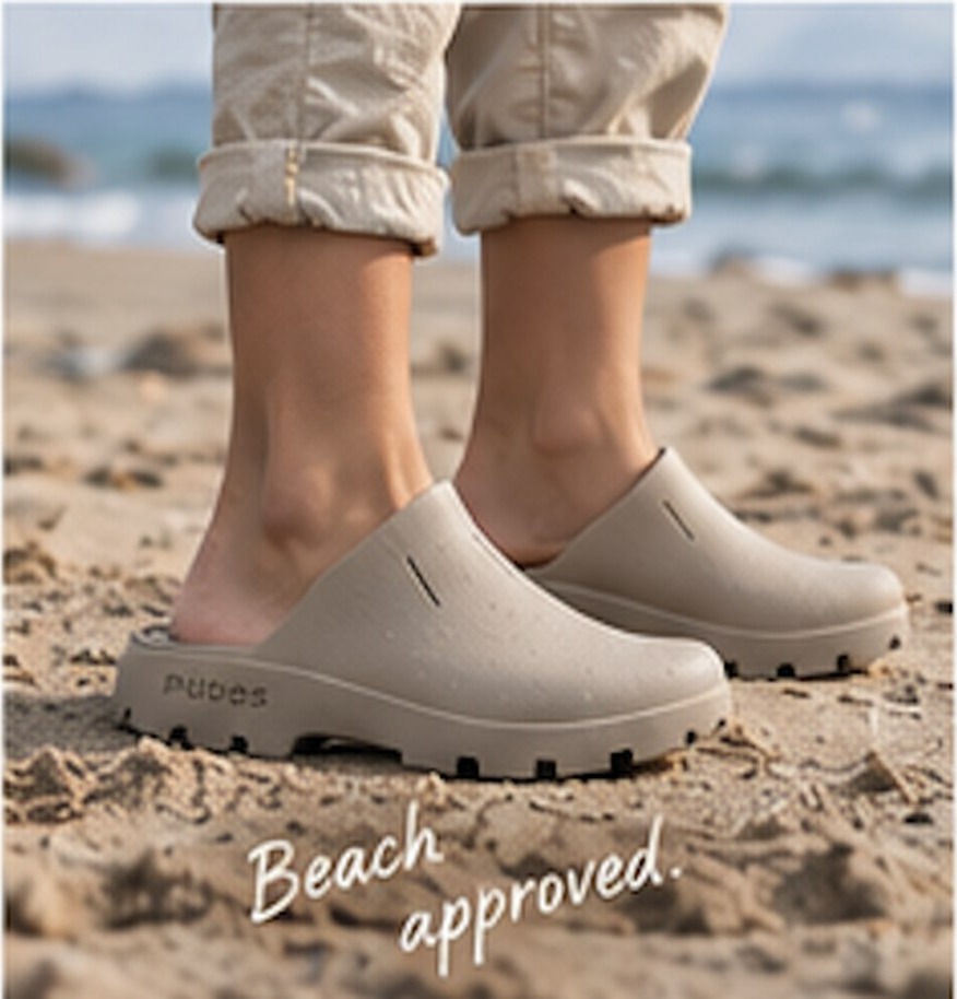 Child in sand PUDDS at the beach